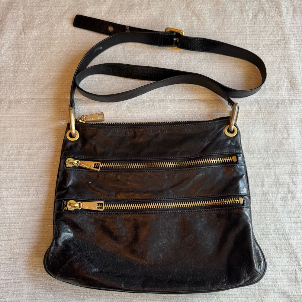 HOBO Brand Black Leather Crossbody Bag with Gold Accents